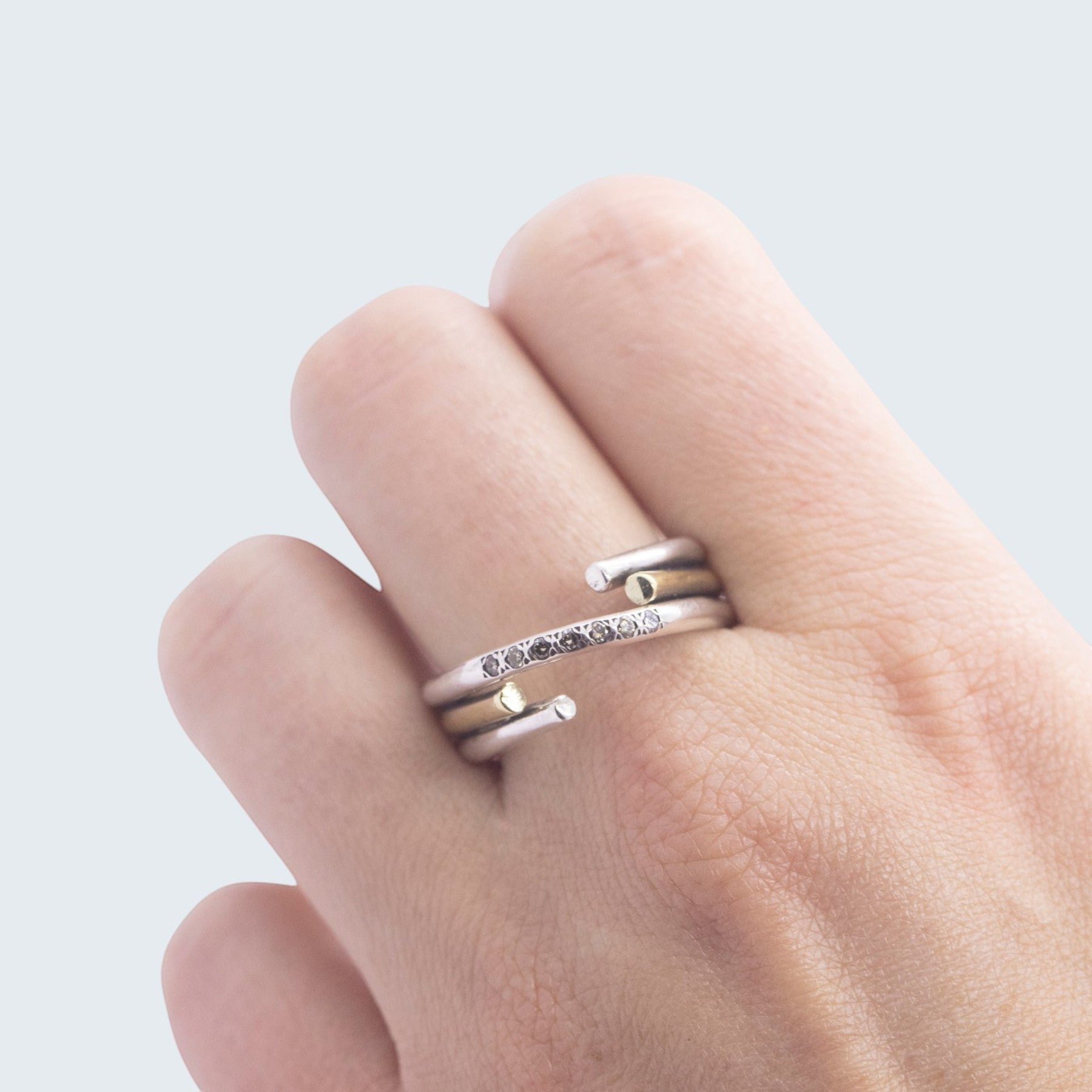 chaotic petite infinity ring in silver and  yellow gold with champagne diamonds, product image side view, INNAN Jewellery Berlin