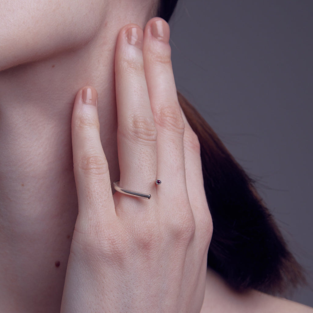 chaotic curve ring in silver with ruby, worn, INNAN Jewellery Berlin