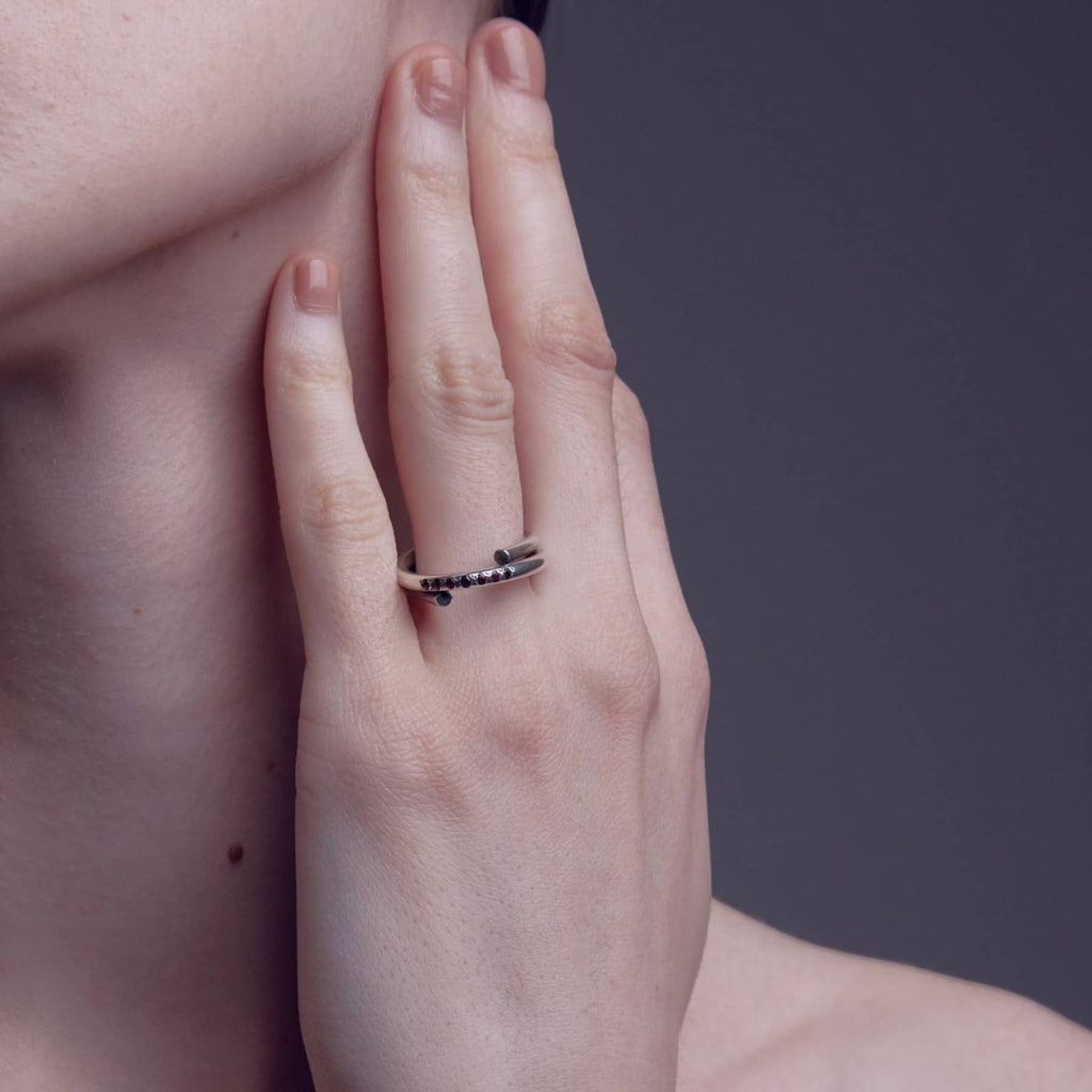 chaotic petite infinity ring in silver with rubies, worn, INNAN Jewellery Berlin