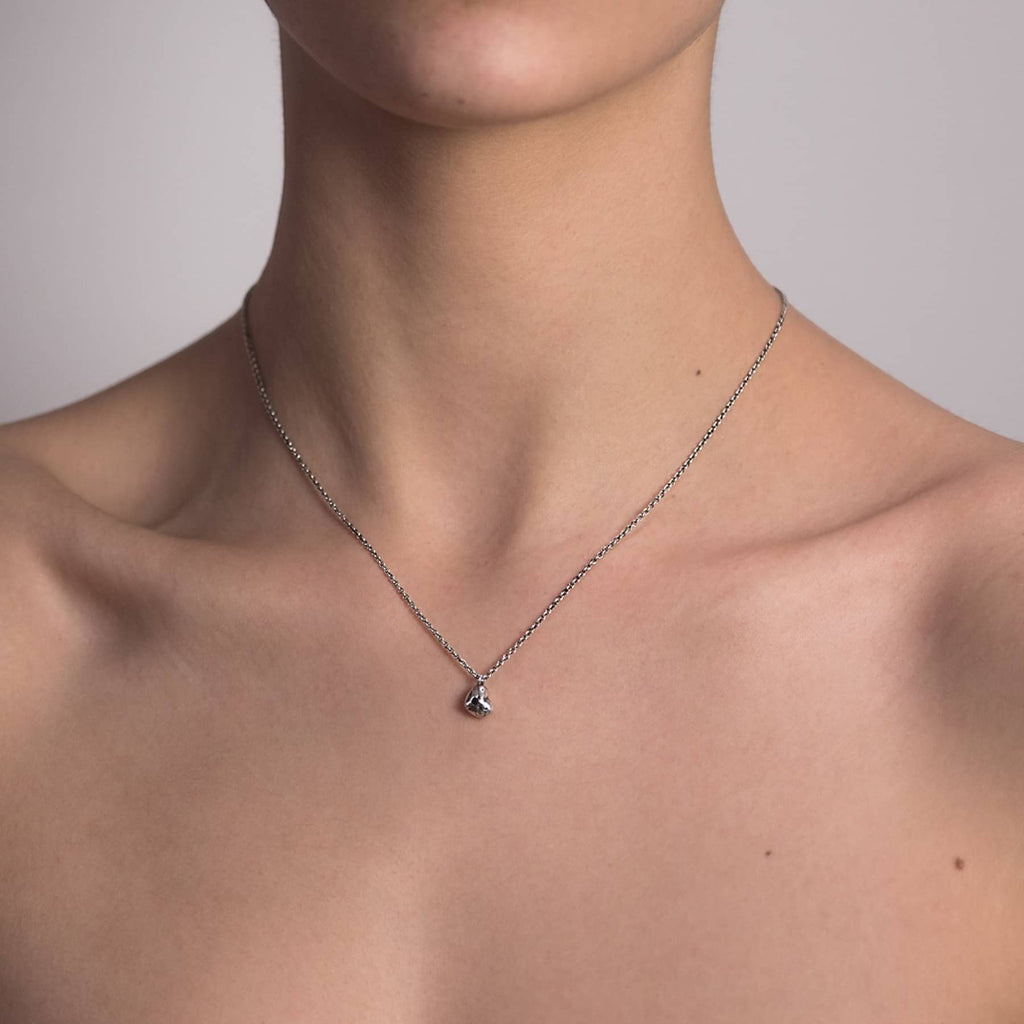 petite desire pendant necklace in silver with black diamond, worn on neck, INNAN Jewellery Berlin