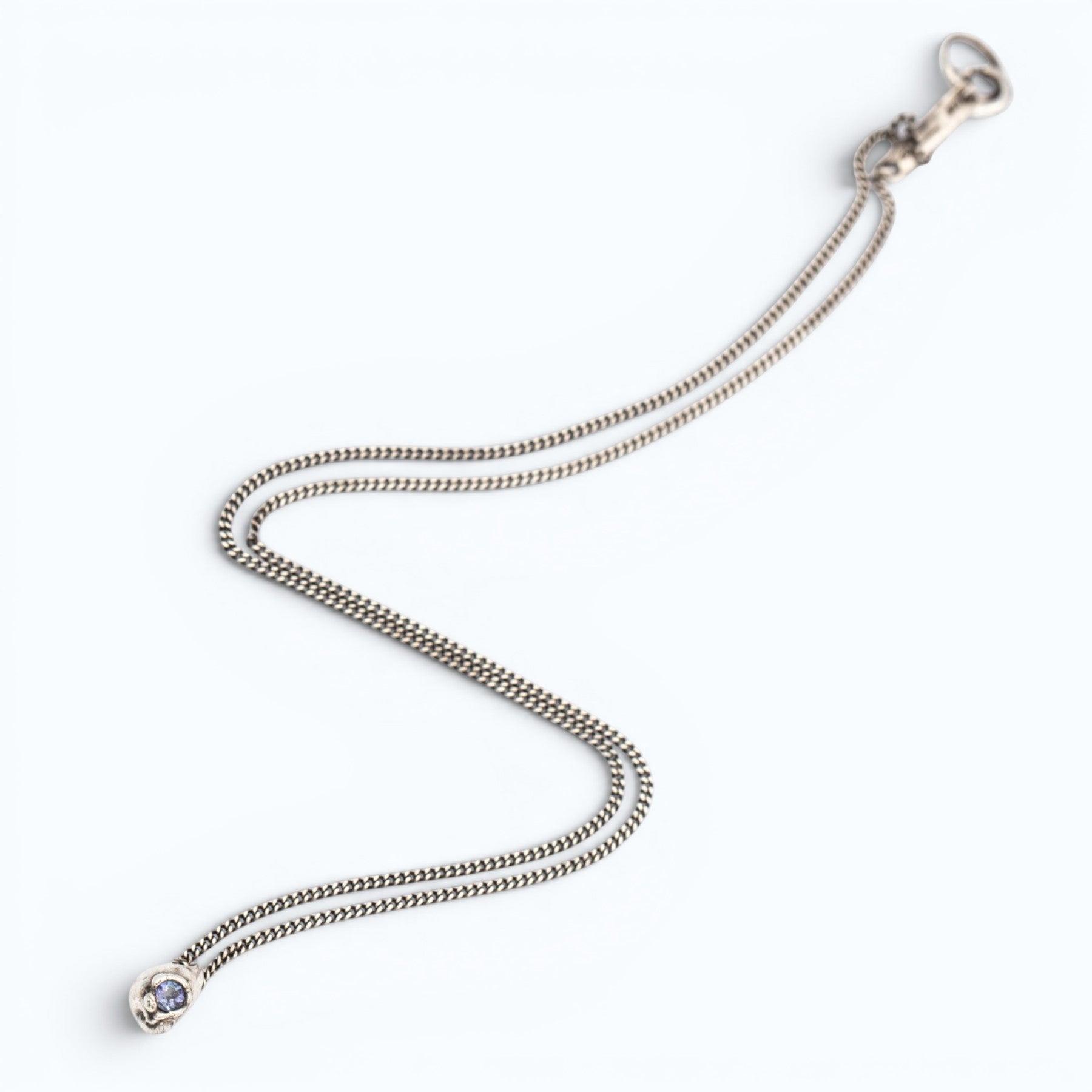 stilla pendant necklace in silver with lilac tanzanite, product image close-up, INNAN Jewellery Berlin