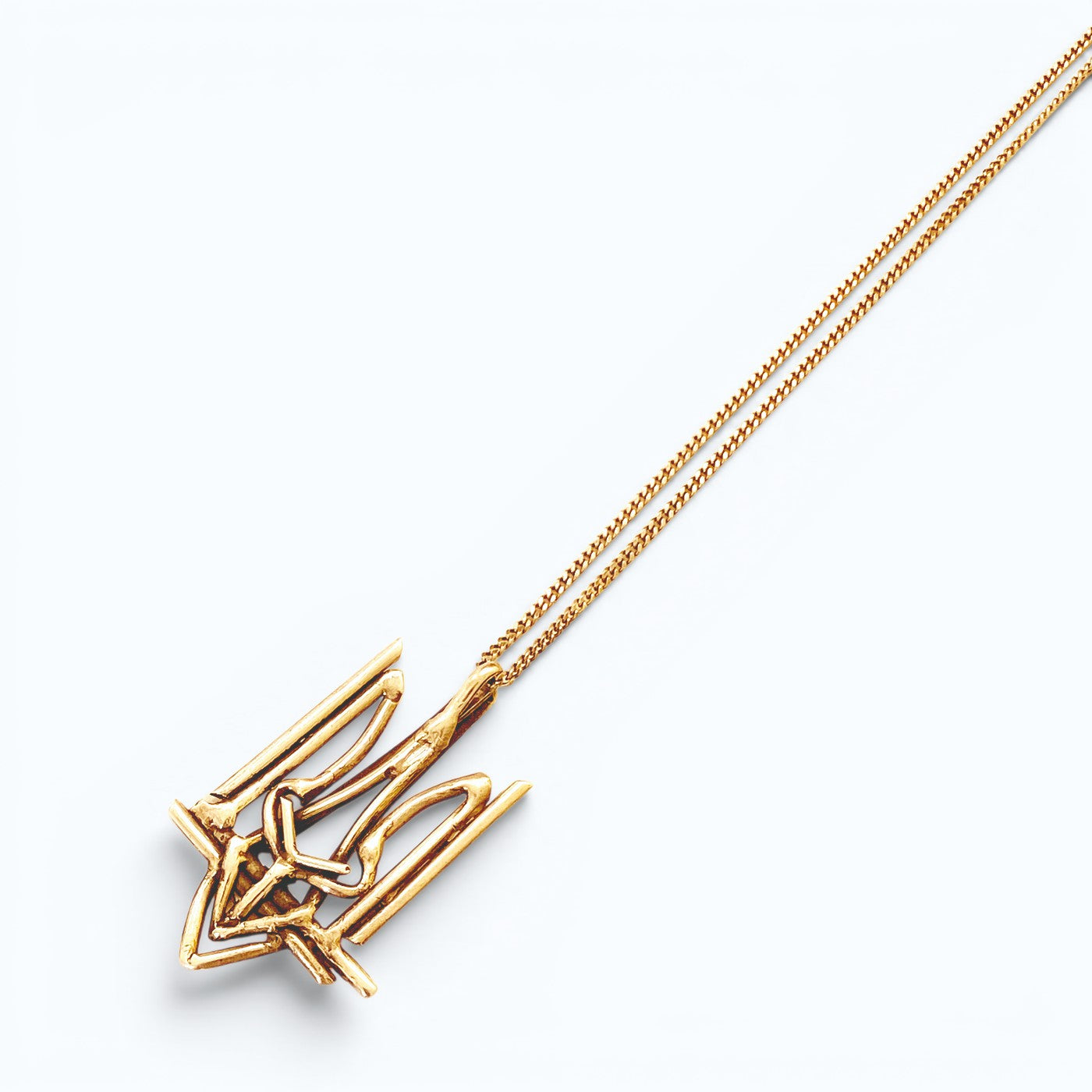 Ukrainian Trident (Tryzub) pendant necklace in silver, product image on artistic background, INNAN Jewellery Berlin