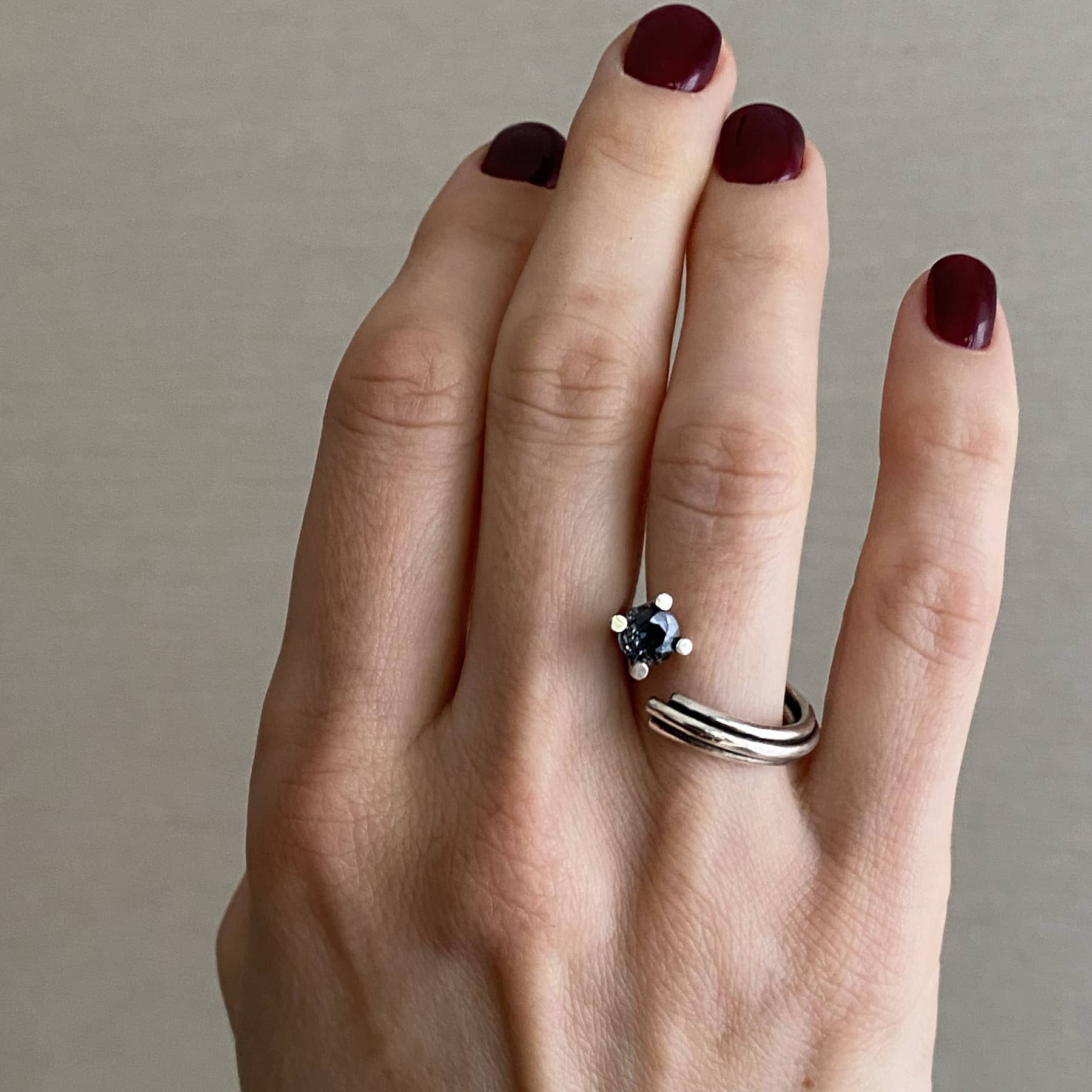close up of a vortex ring in silver with grey spinel, product image side view, INNAN Jewellery Berlin