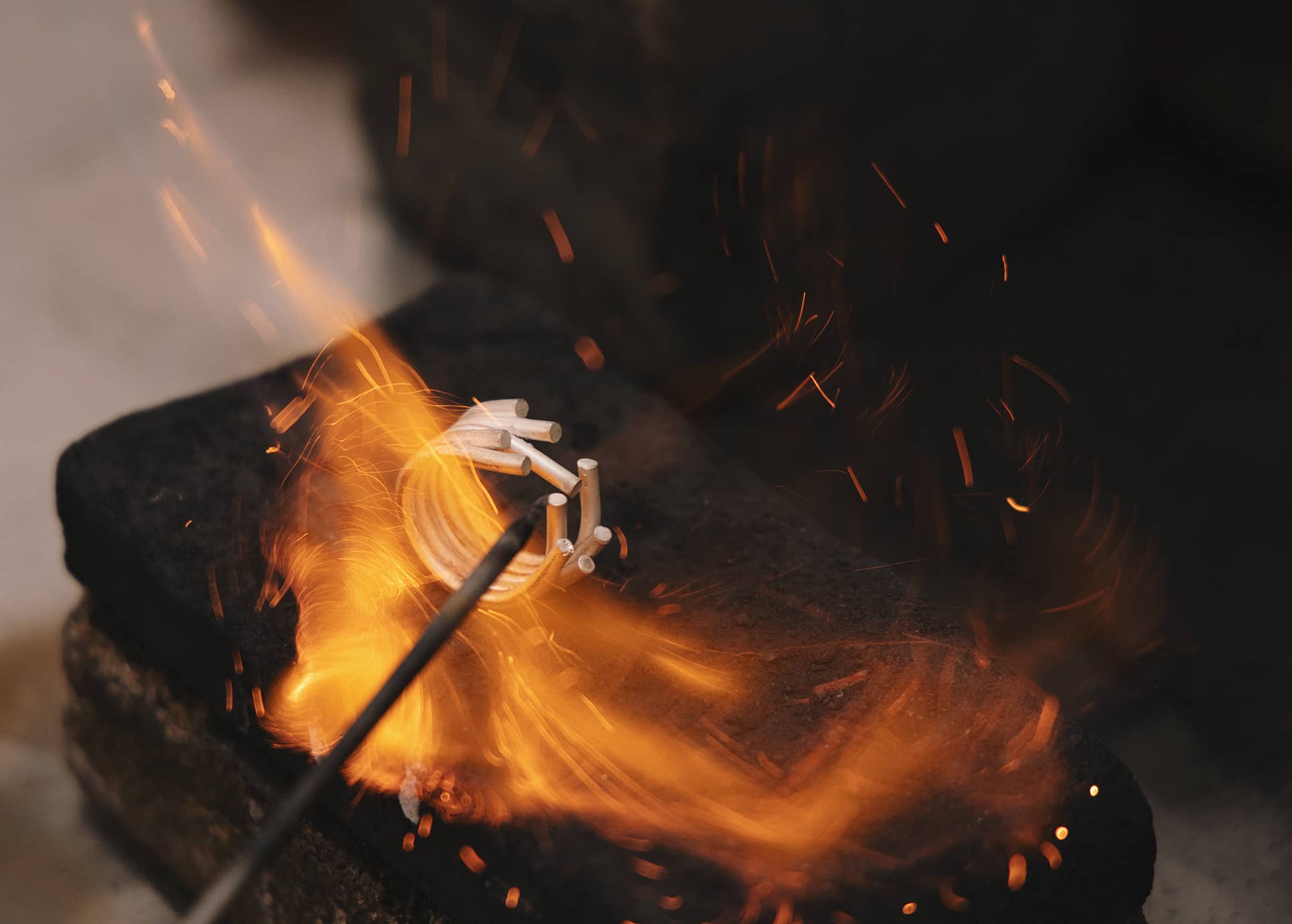 Close-up of Chaotic ring being soldered in flame during the making process by Innan Jewellery