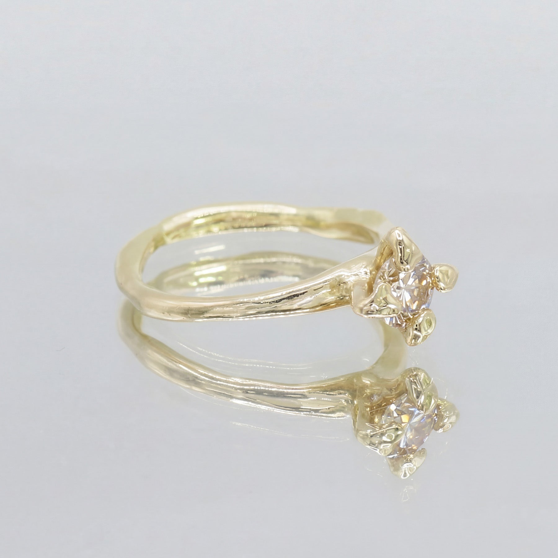 Front view of Anish engagement ring in 18 ct yellow gold with a 0.5 ct champagne diamond by Innan Jewellery