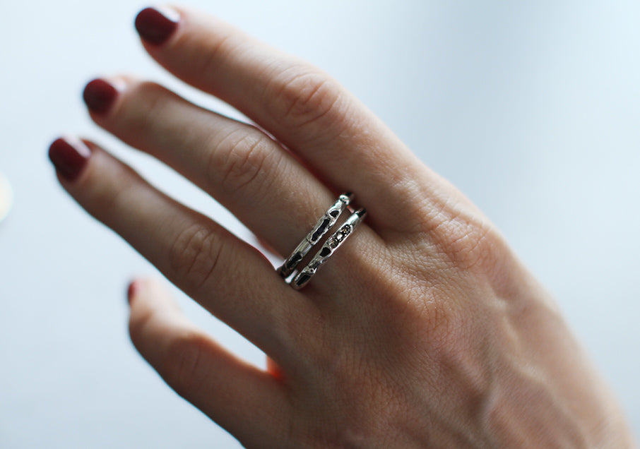 antre rings  silver with champagne diamonds worn, representing the antre collection, INNAN Jewellery Berlin