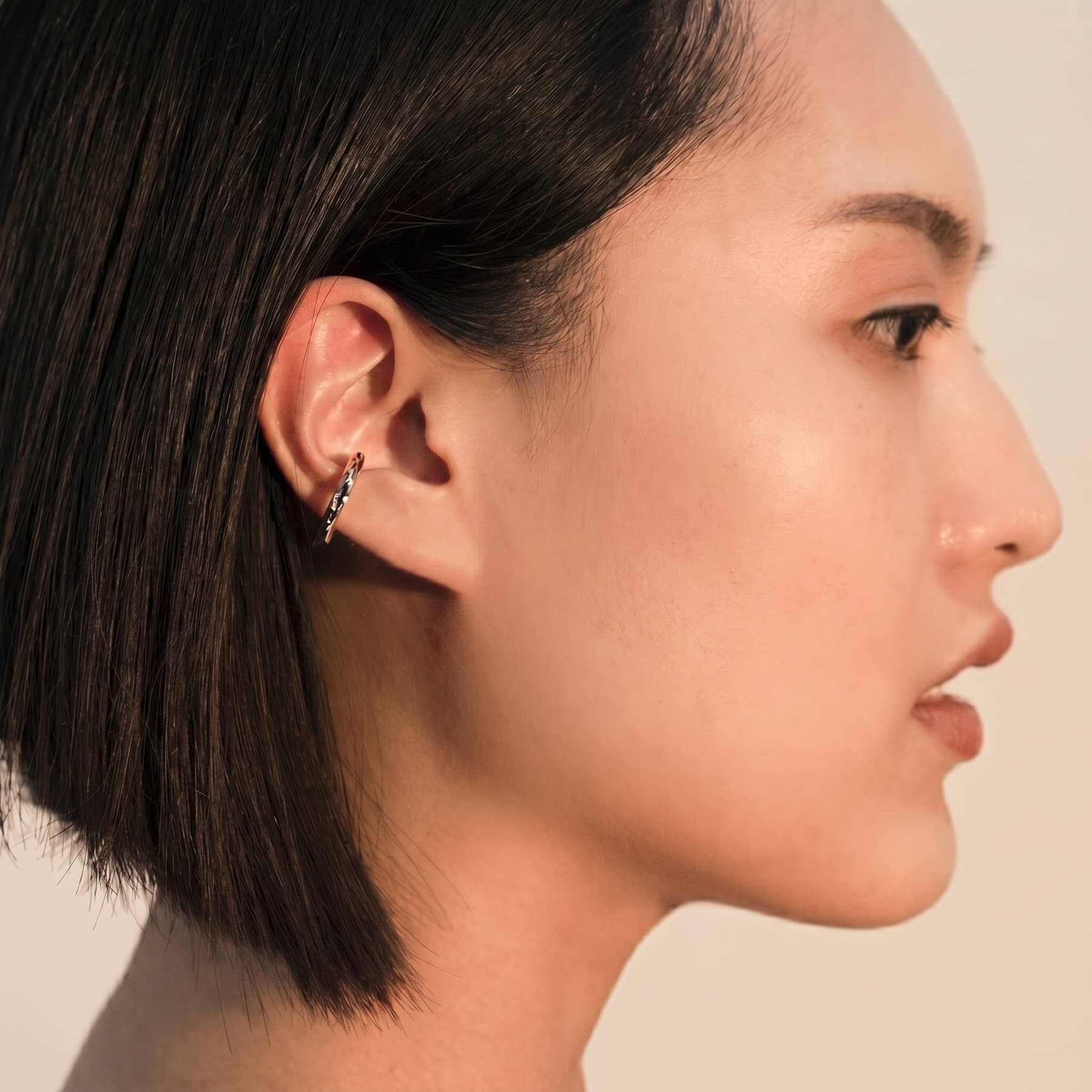 silver cenote ear cuff, worn on ear, INNAN Jewellery Berlin