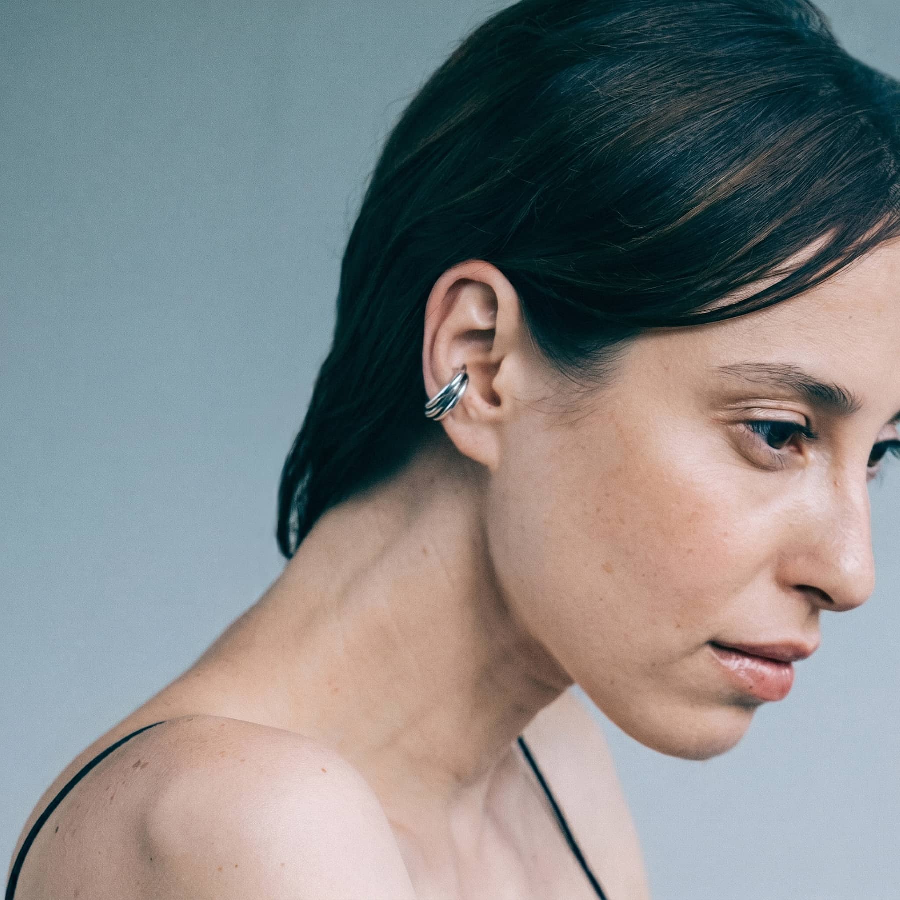silver flow ear cuff , worn on ear, INNAN Jewellery Berlin