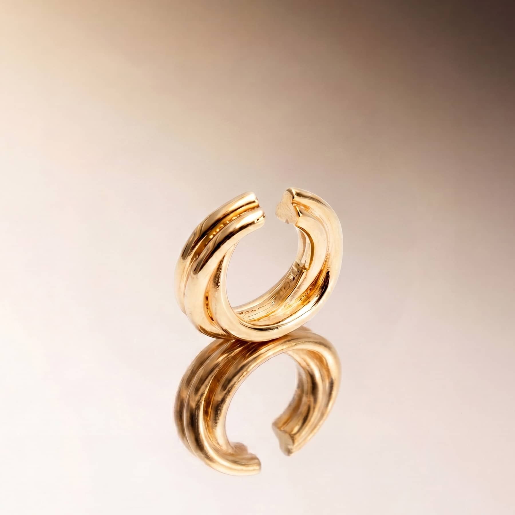 silver flow ear cuff , worn on ear, INNAN Jewellery Berlin