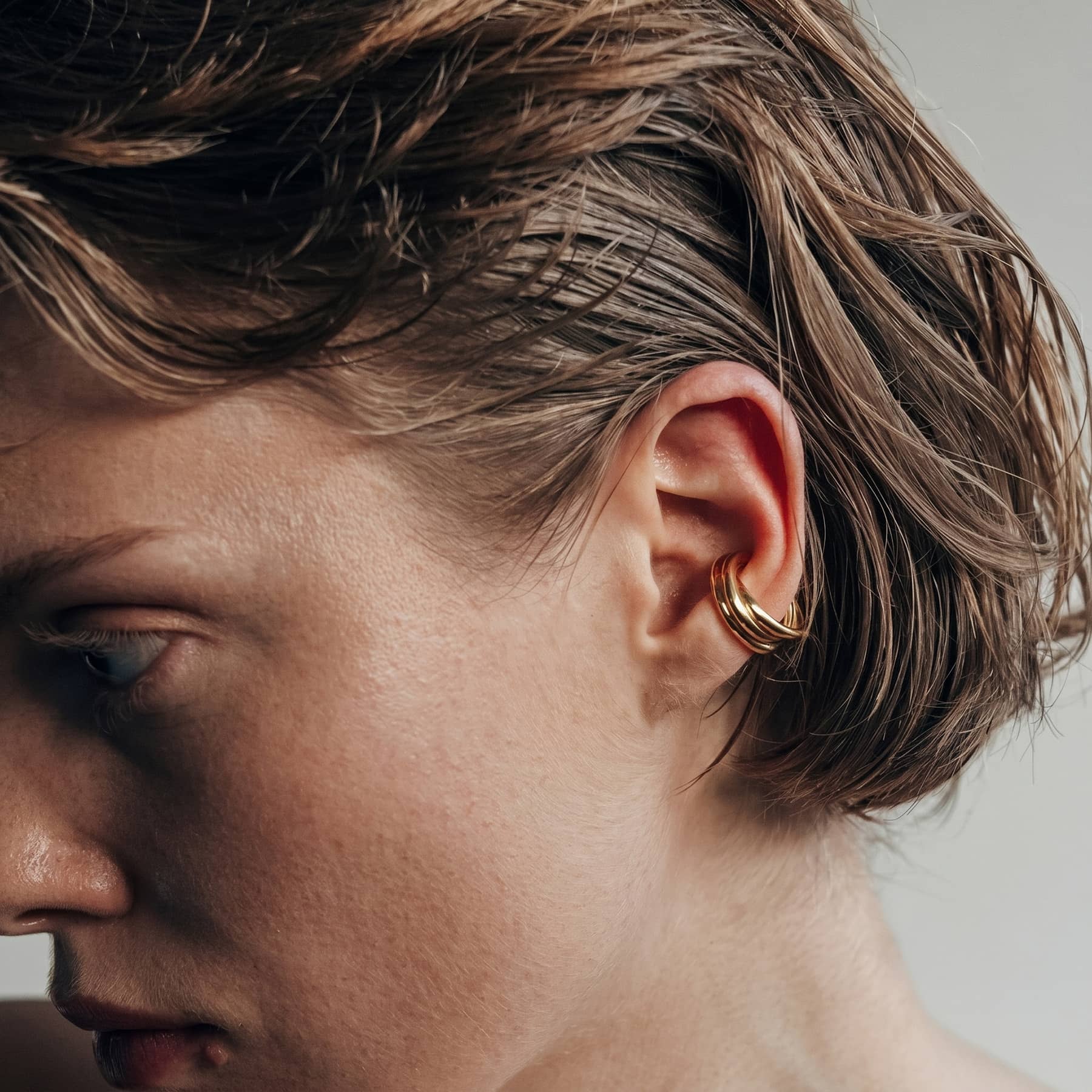 silver flow ear cuff , worn on ear, INNAN Jewellery Berlin