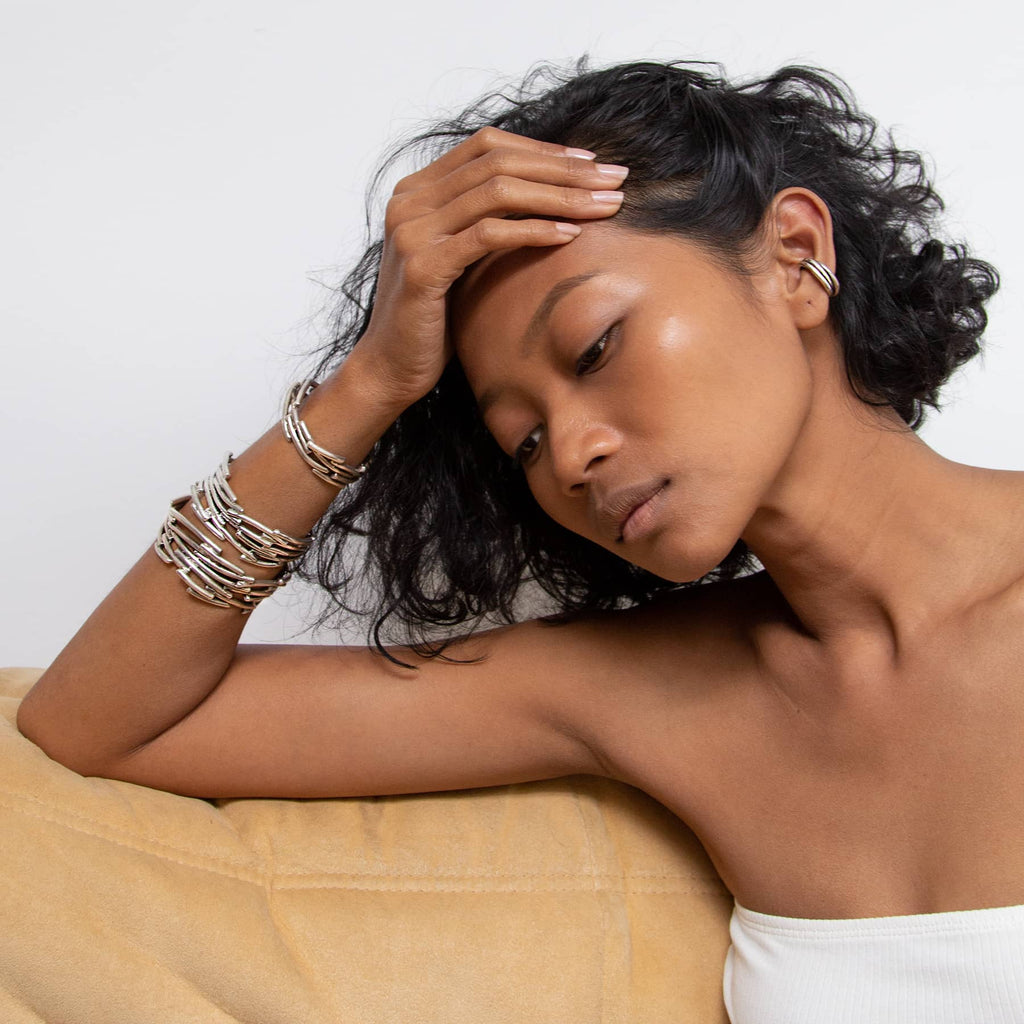 petite flow bracelet in silver, worn combined with flow bracelets, INNAN Jewellery Berlin