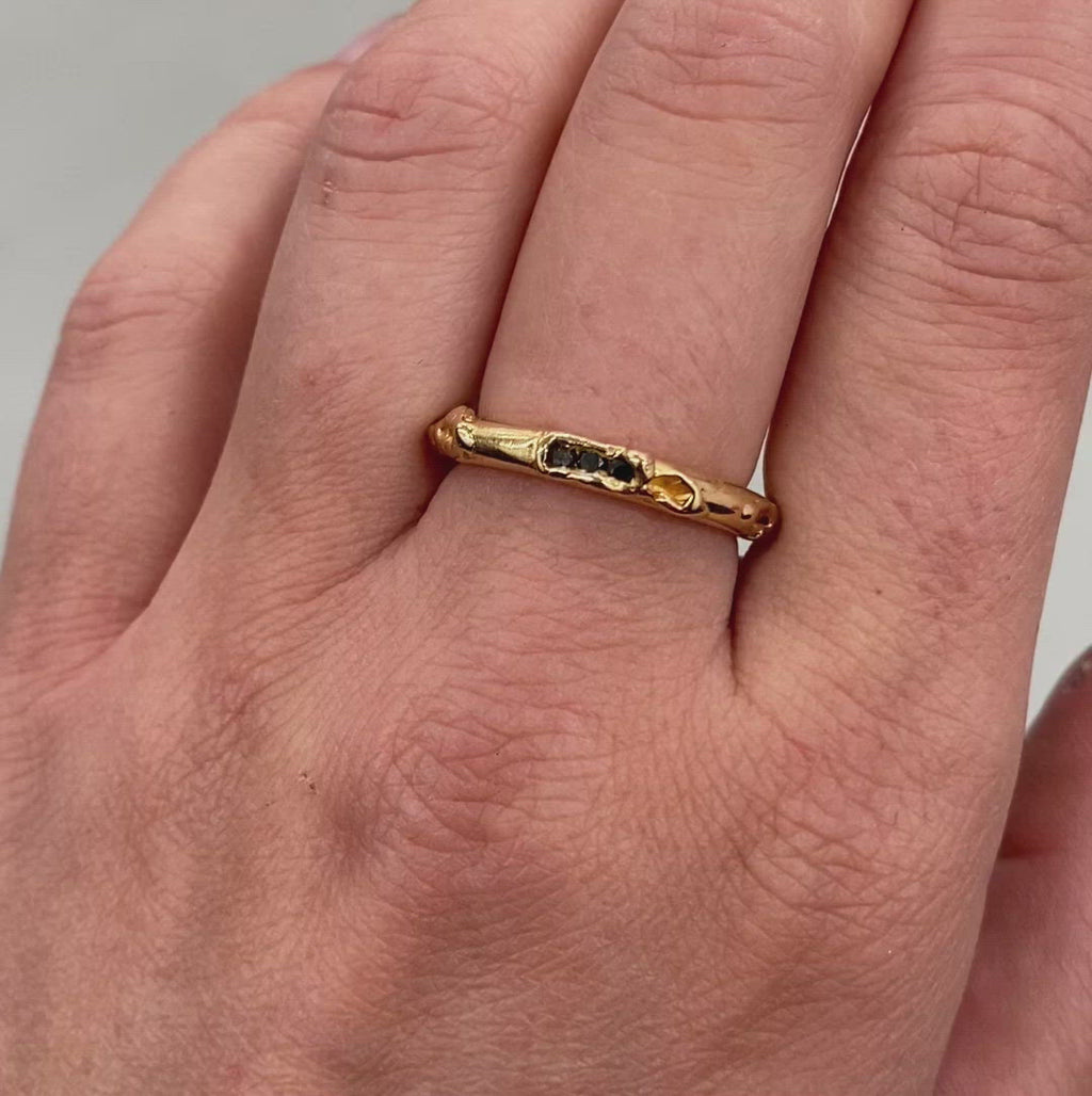 video of the antre golden ring with black diamonds worn on hand