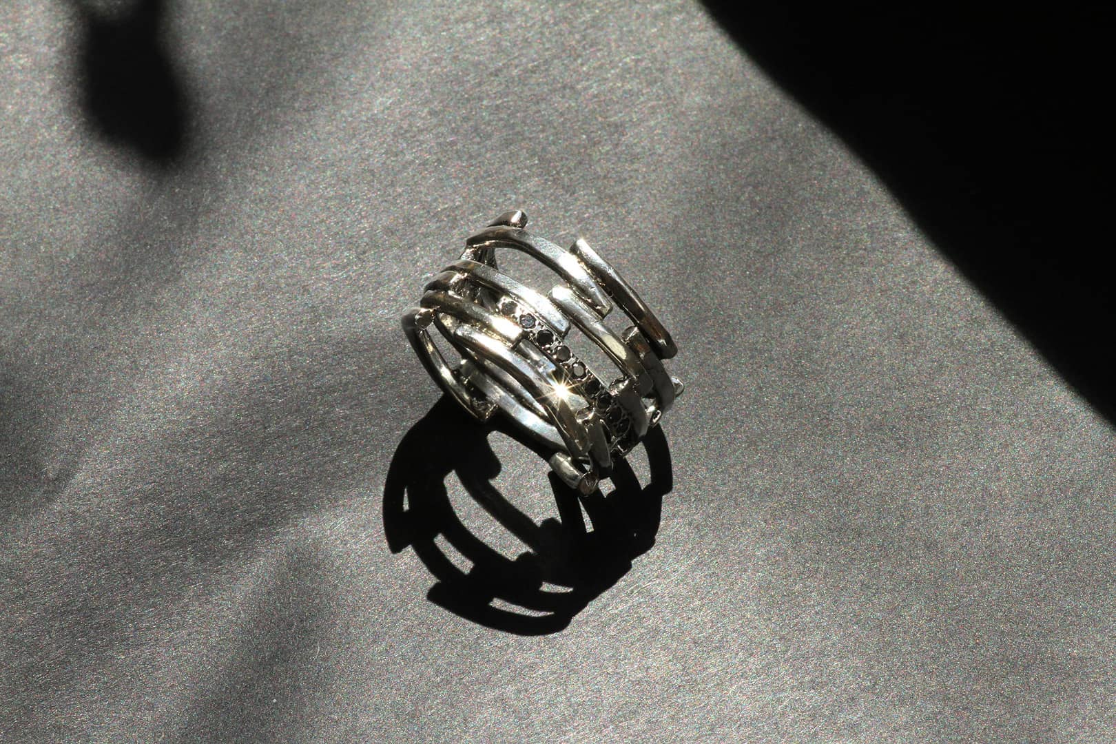 Flow ring in silver with black diamonds by Innan Jewellery