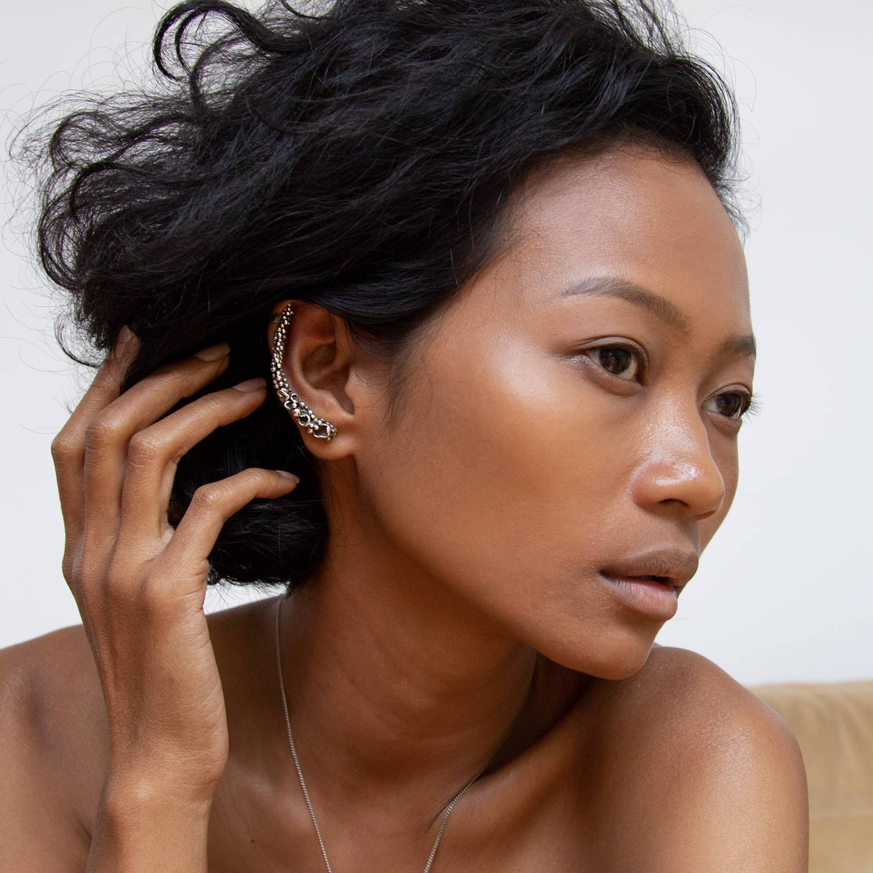 silver stardust ear cuff, worn on ear, INNAN Jewellery Berlin