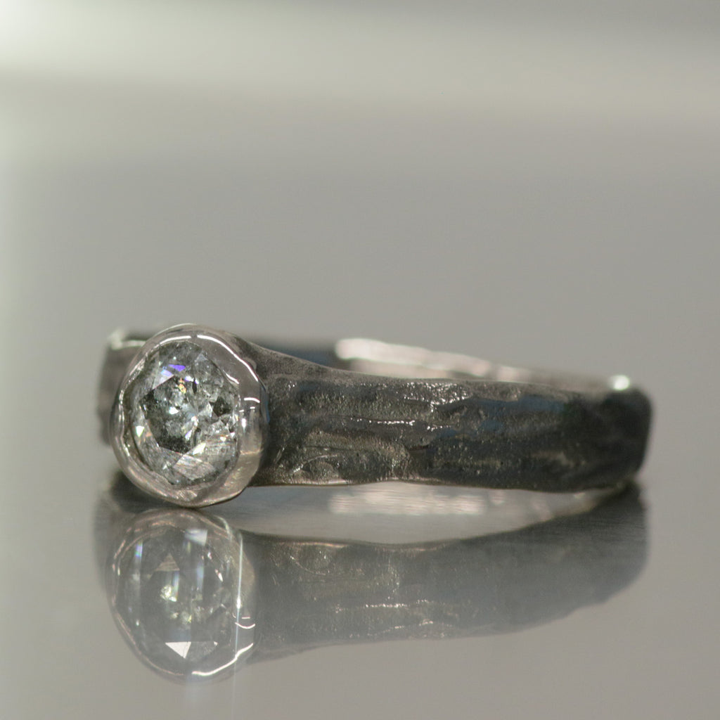 Side view of Verve engagement ring in 18 ct white gold with a 0.52 ct salt and pepper diamond by Innan Jewellery
